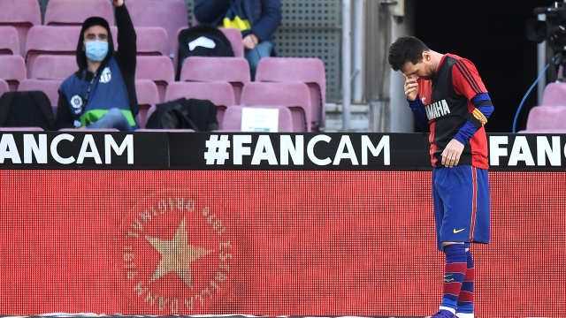 BARCELONA, SPAIN - NOVEMBER 29: Lionel Messi of Barcelona reacts after scoring their sides fourth goal while wearing a Newell's Old Boys shirt with the number 10 on the back in memory of former footballer, Diego Maradona, who recently passed away during the La Liga Santander match between FC Barcelona and C.A. Osasuna at Camp Nou on November 29, 2020 in Barcelona, Spain. Sporting stadiums around Spain remain under strict restrictions due to the Coronavirus Pandemic as Government social distancing laws prohibit fans inside venues resulting in games being played behind closed doors. (Photo by David Ramos/Getty Images)